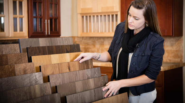 Woman looking at flooring options at a store