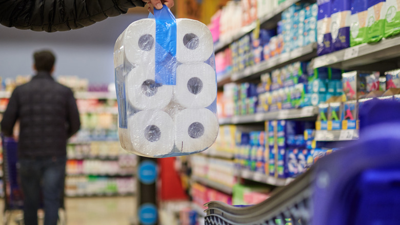 buying toilet paper in store