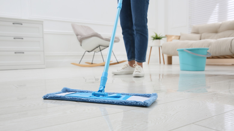 Woman mopping shiny floor