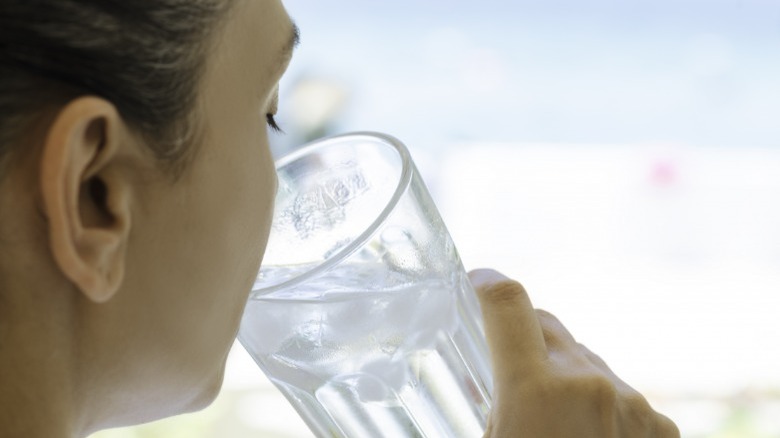 Person drinking ice cold water