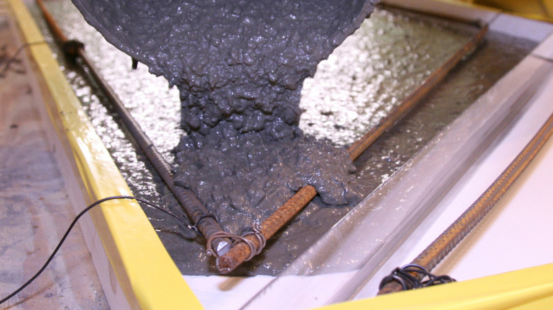 Pouring Quikrete Countertop Mix into a mold with rebar for reinforcement