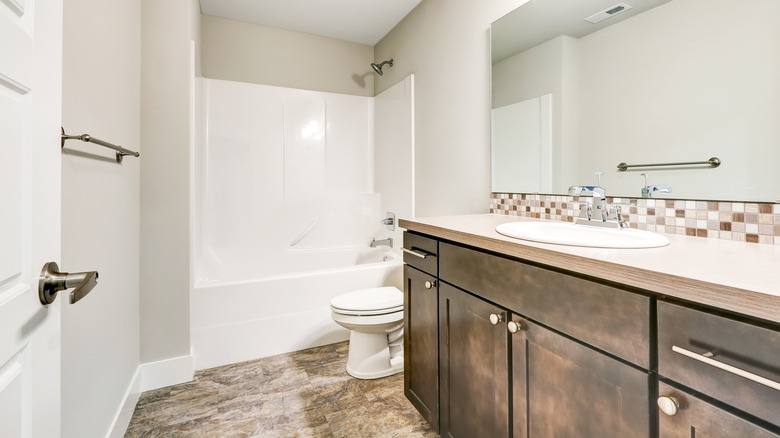 White bathroom with shower-tub combo