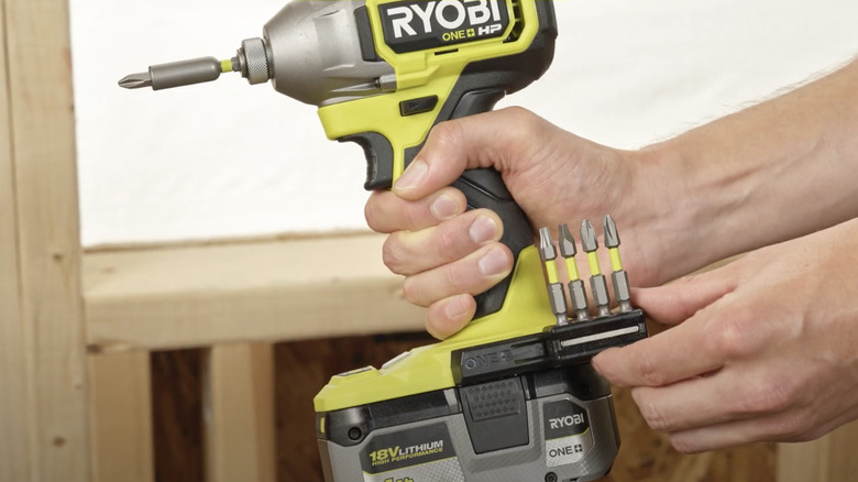 Sliding the bit attachment onto Ryobi's Rail System