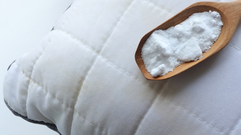 Spoon of salt on stained pillow