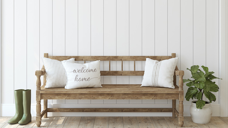 White shiplap behind bench