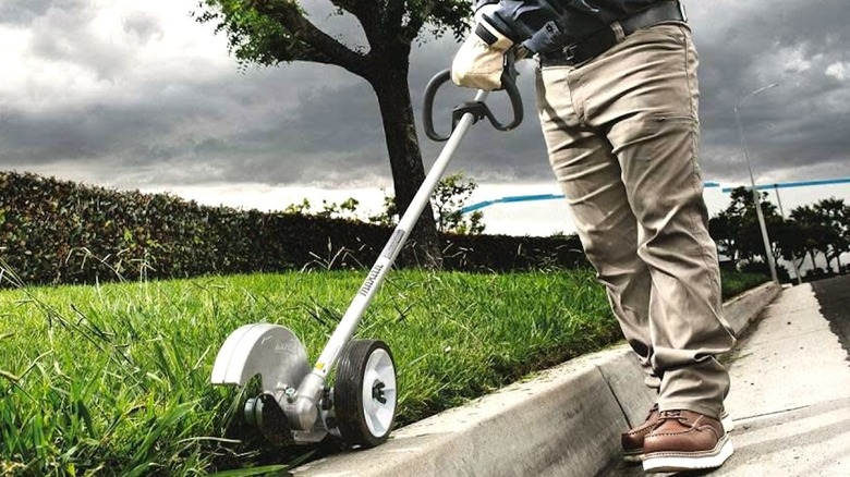 Trimming a grass border with the Makita 40V max XGT Brushless Cordless Edger