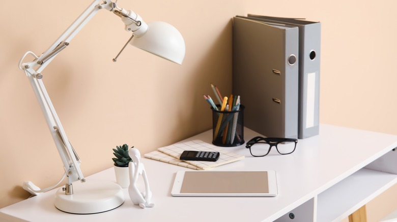 desk lamp with head tilt on work desk in home office