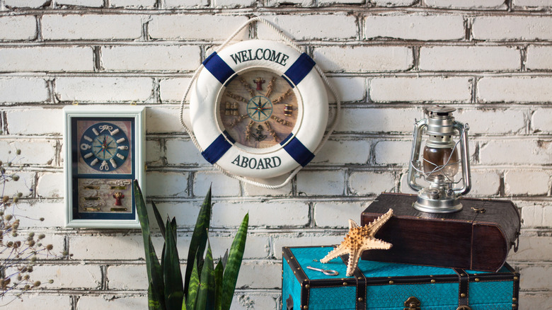 Nautical-themed decor on a brick wall and as standalone decorative pieces