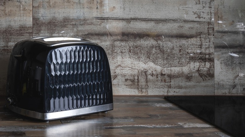 black pop-up toaster sitting on kitchen counter