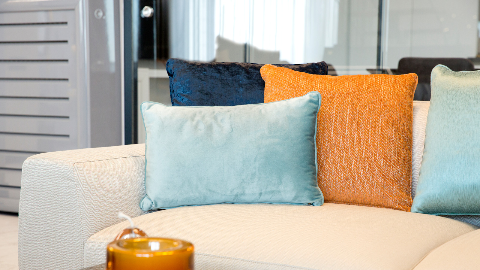 Blue couch orange pillows hot sale
