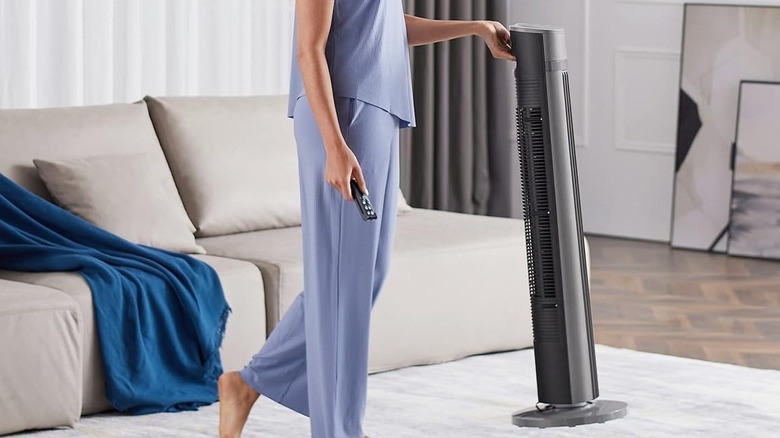 Woman carrying pelonis fan