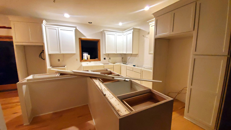 A kitchen renovation is shown in progress