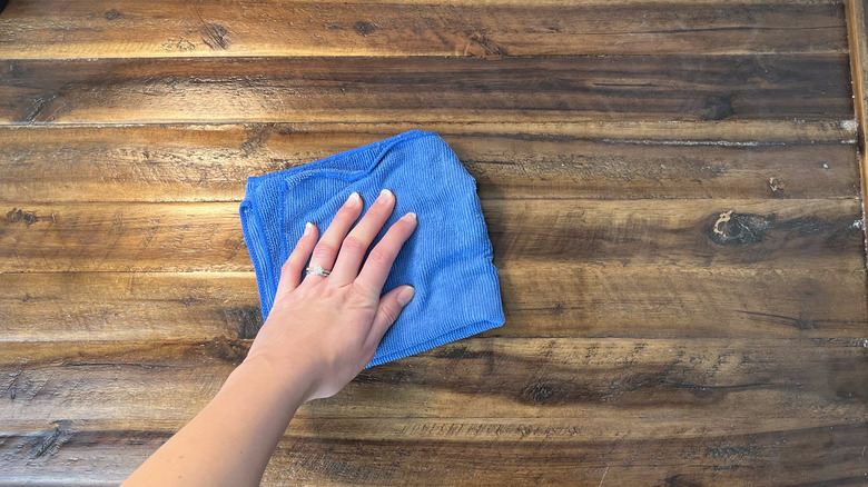 wiping wood with DIY cleaner