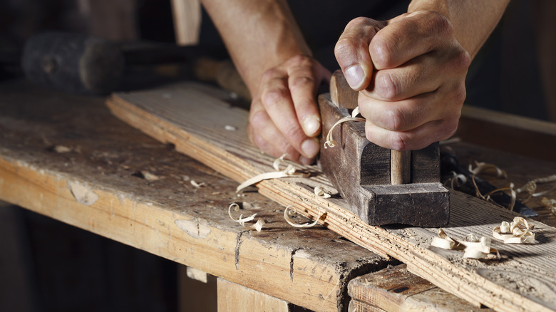 Person using wood planer