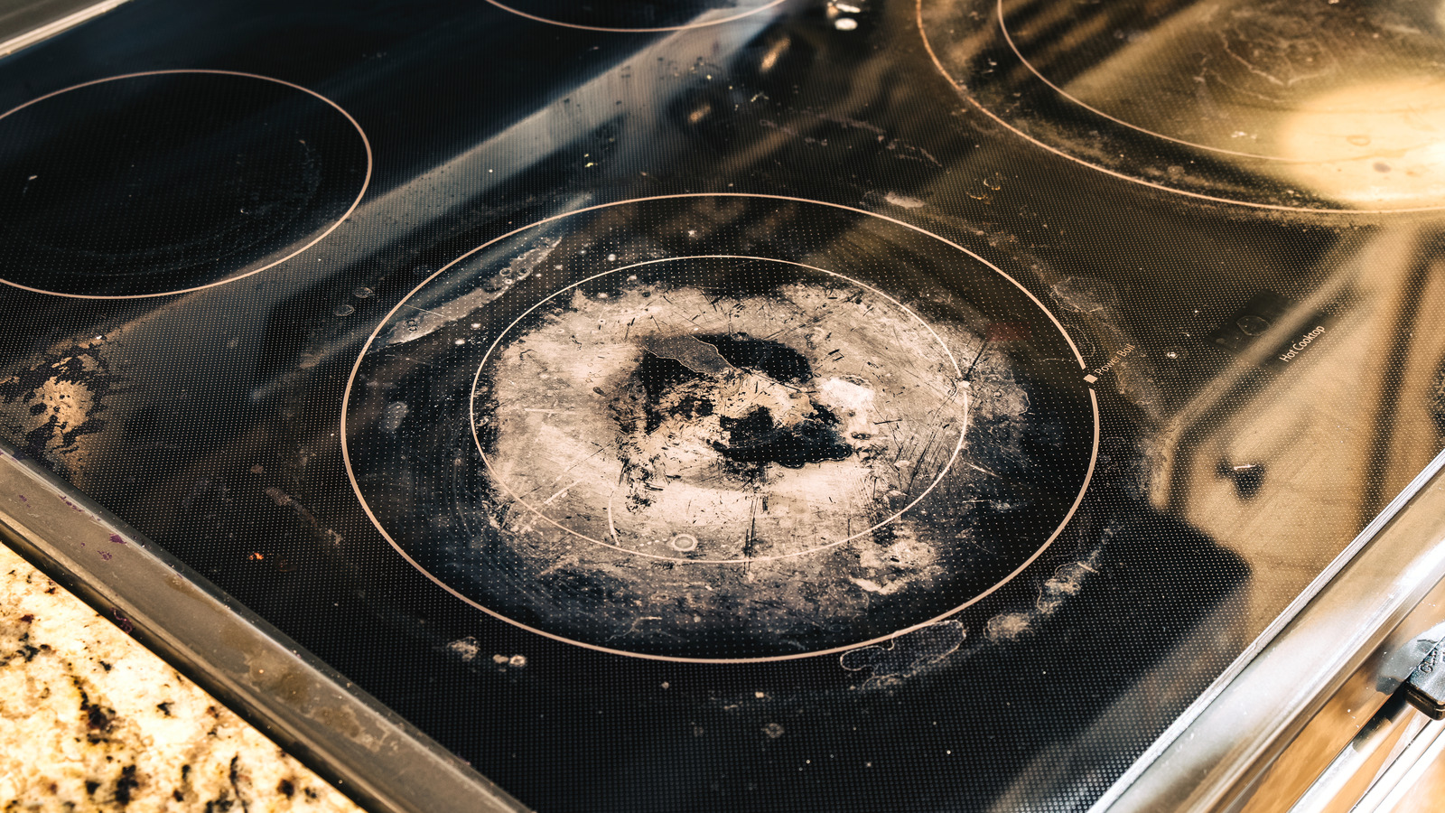 Is Using A Razor Blade To Clean A Burnt Stove Top A Good Idea?