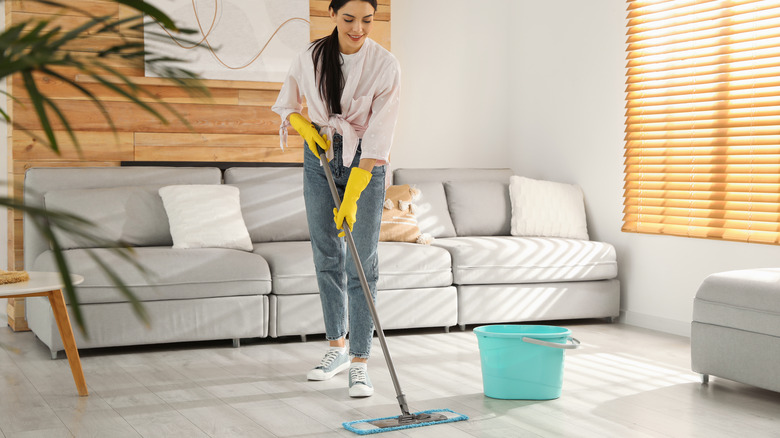 Woman mopping floor
