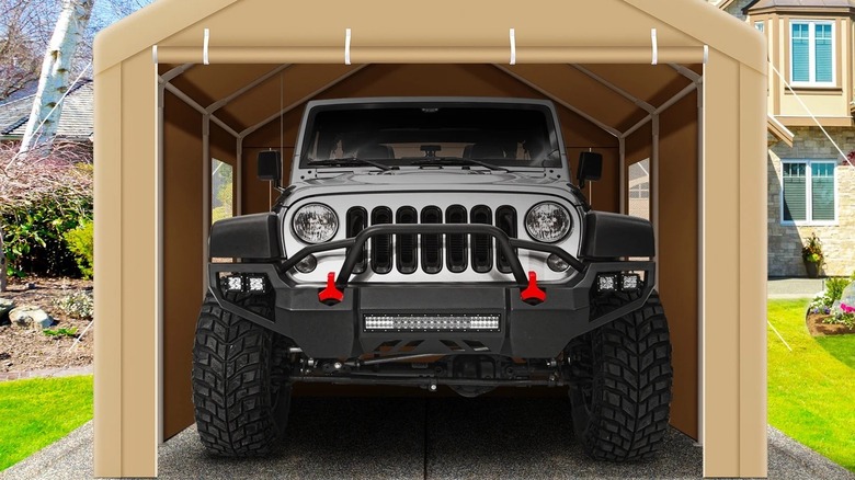 Off-road vehicle parked inside a fabric carport