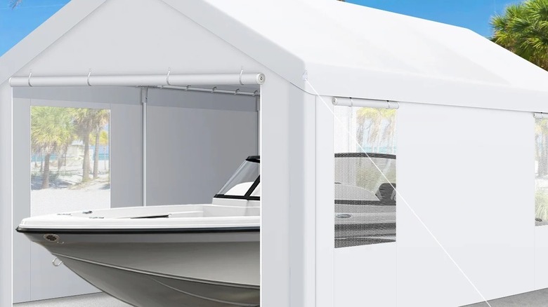 Boat parked inside a fabric carport