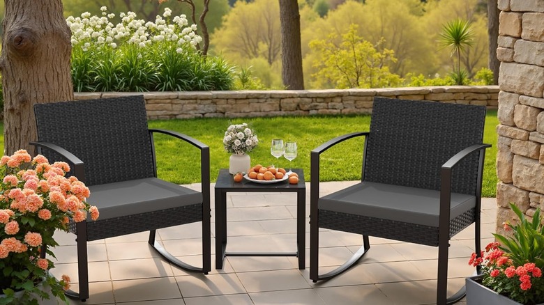 Homall 3-piece set on the back patio with fruit, wine, and flowers on the table and flowers around the set