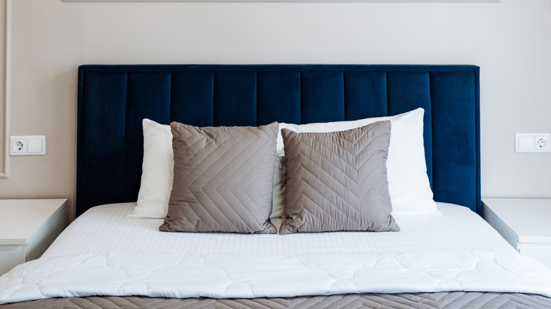 Bed with blue headboard