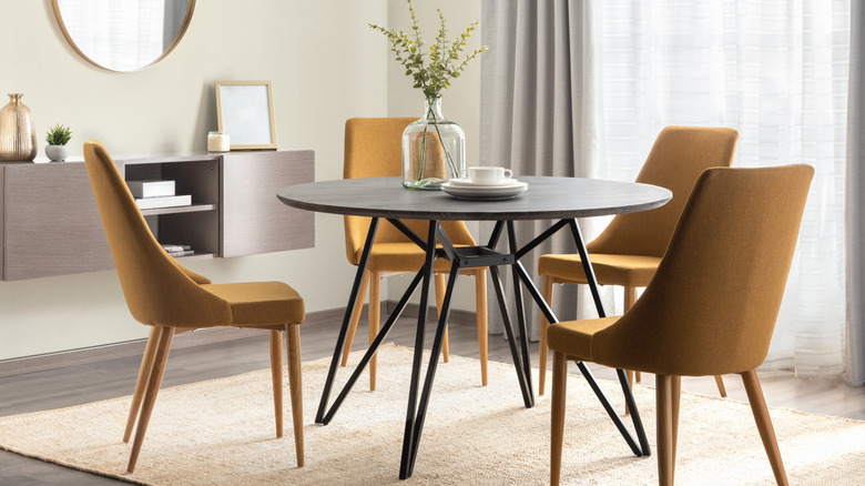 Small round dining table with decor