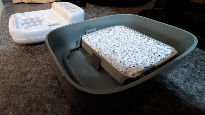 Two parts of disassembled Shelfy, showing natural filter