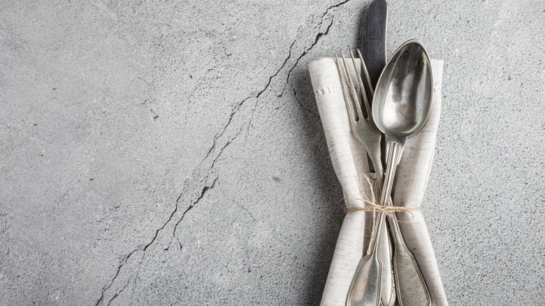 Silverware on cloth napkin