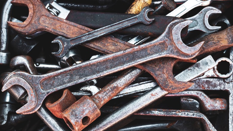 A collection of rusty and grimy tools