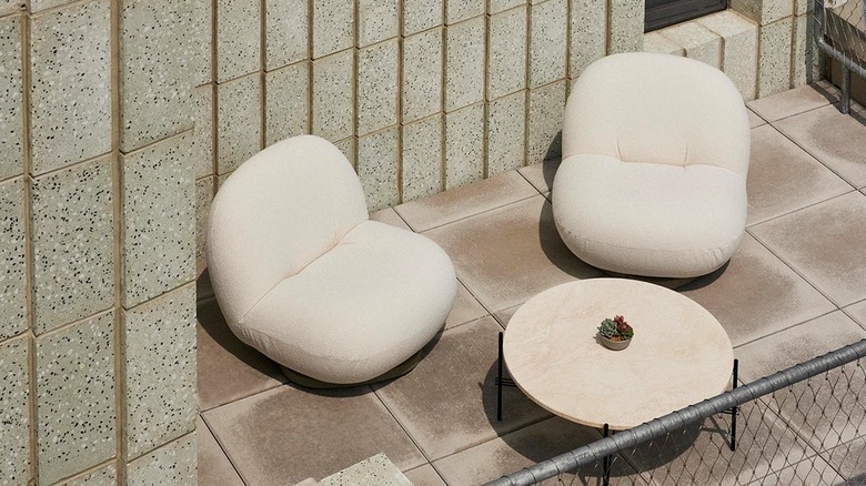 Two white Pacha outdoor lounge chairs