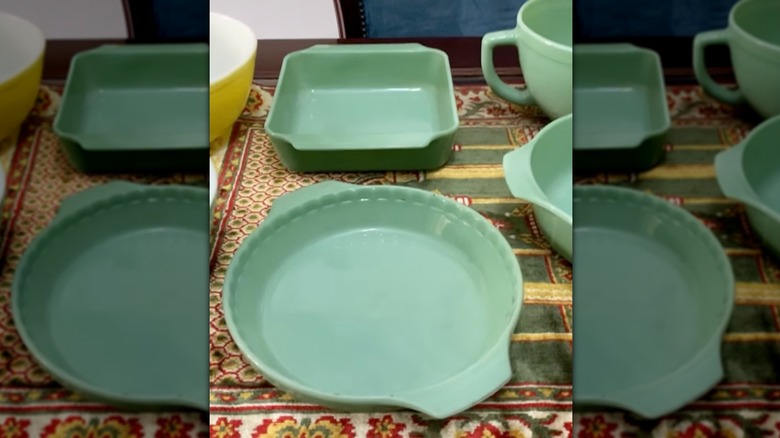 Jadeite Fire King cookware from Anchor Hocking displayed on table.