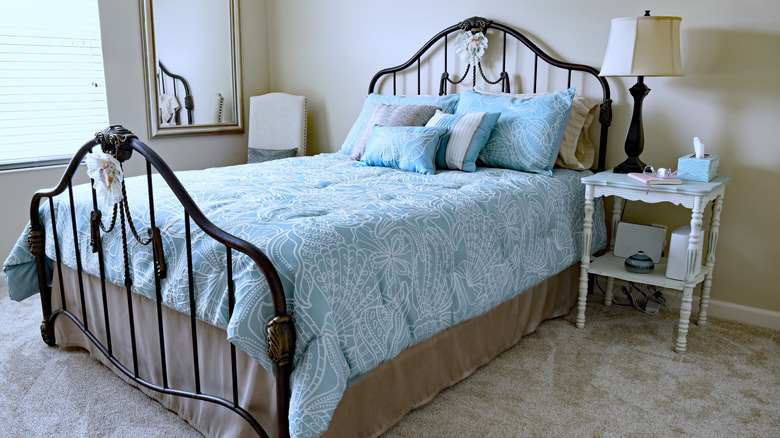 cast iron bed in bedroom