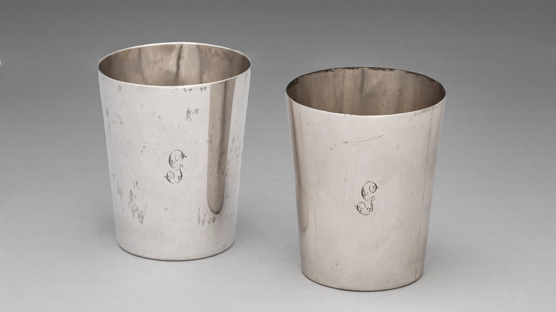 Two silver cups crafted by Paul Revere.