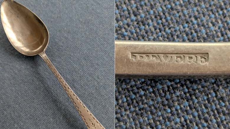 An antique silver spoon crafted by Paul Revere with a Revere mark on the back of the spoon handle.