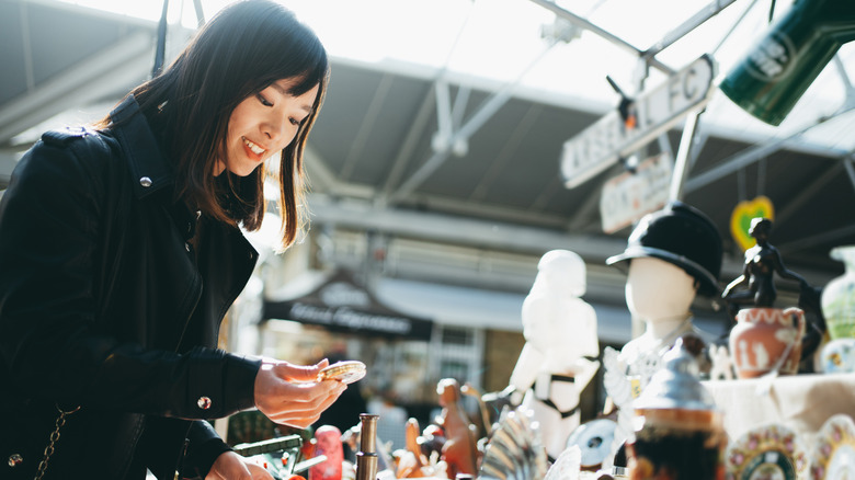 Woman antique shopping outdoors
