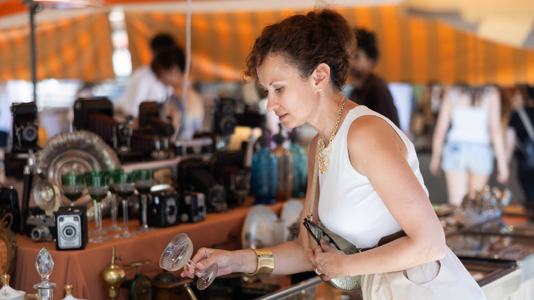 woman shopping for antique house wares