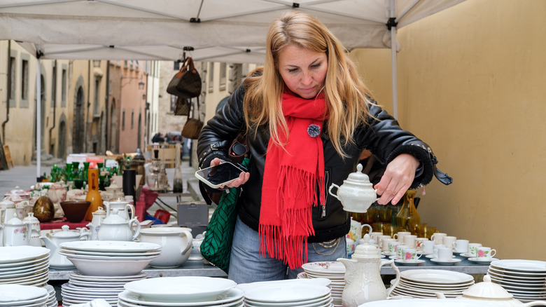 Woman shipping for vintage dishes