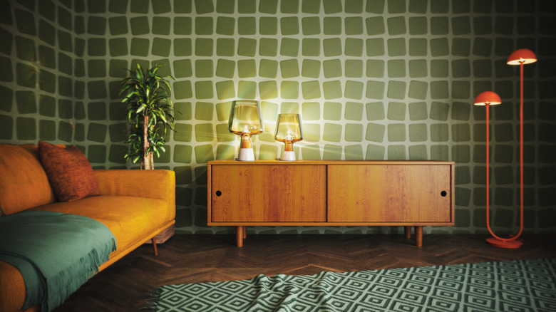 A living room is outfitted in low furniture and colors that were popular in the 1970s