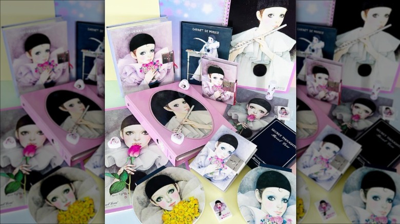 A collection of Mira Fujita items featuring sad Pierrot clowns