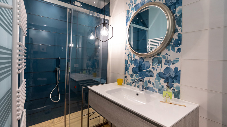 A blue and white tiled bathroom.