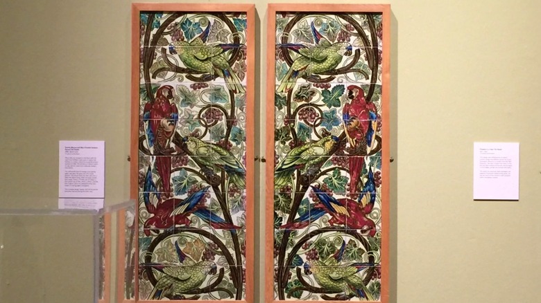 William De Morgan tile set on display in a museum.