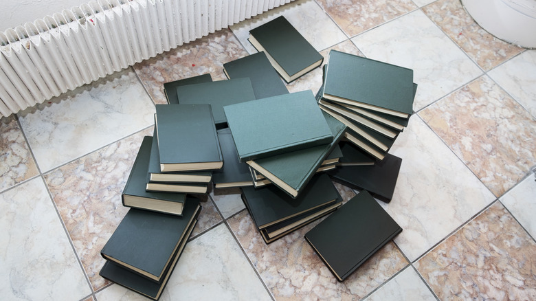 A pile of books on the floor