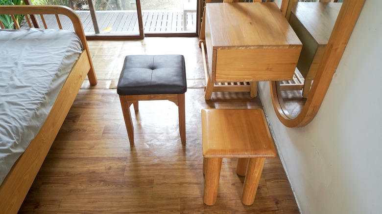 a bedroom with wooden furniture