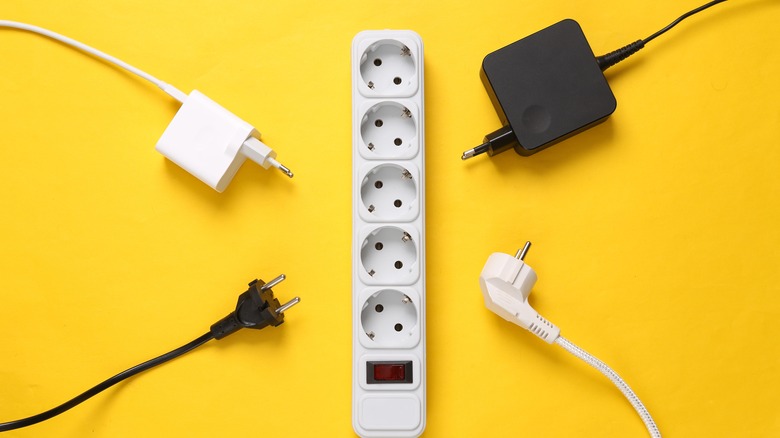 Power strip surrounded by plugs