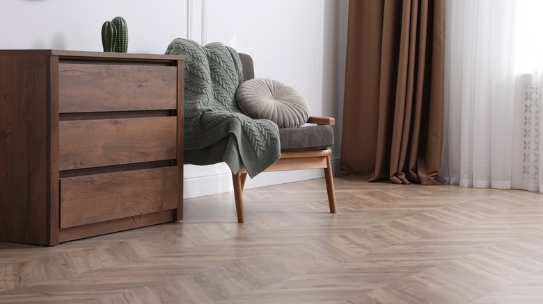 Chair and dresser on parquet floor