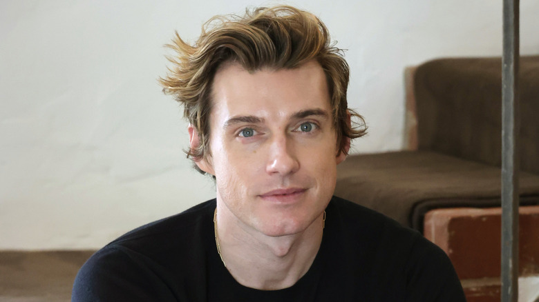 Jeremiah Brent smiles slightly