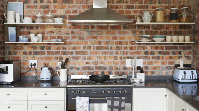 A brick feature wall in a kitchen.