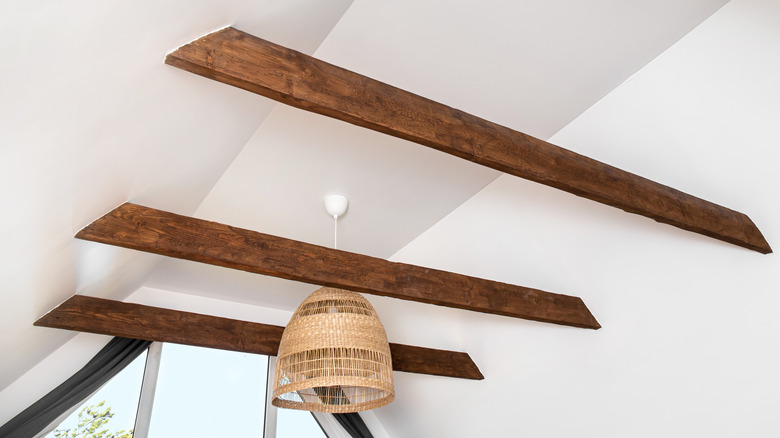 wooden beams with rattan light