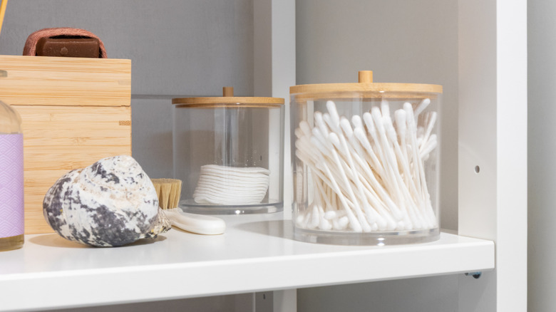 Cotton rounds and cotton buds kept in glass jars