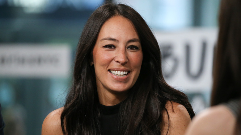 Joanna Gaines walks a red carpet at the Time 100 event.
