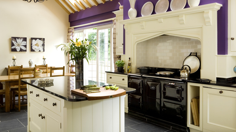 vintage all-white kitchen island in refurbished kitchen